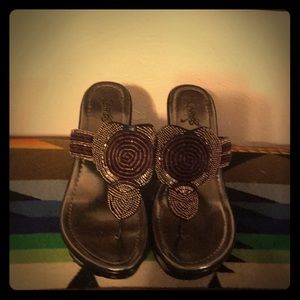 Carlos Santana sandals three inch heals